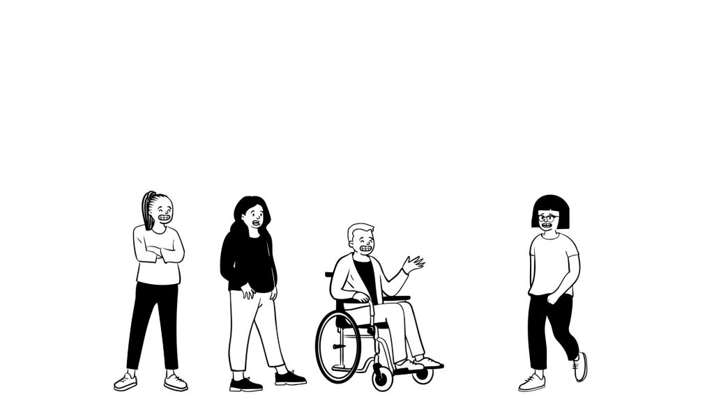 Gruppe von vier Menschen, eine Person im Rollstuhl gestikuliert.